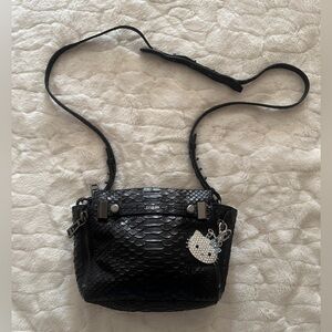 Botkier Leroy Crossbody Bag  with an embossed anaconda or snakeskin texture.